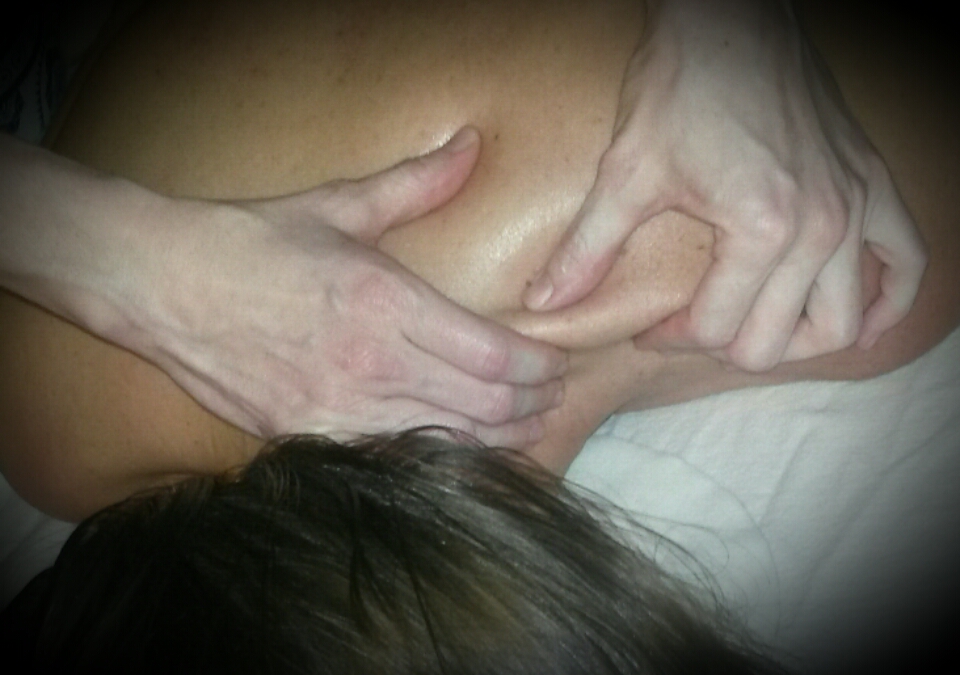 Close-up of Andrea Murtha performign deep tissue massage